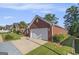 A brick home featuring an attached two-car garage and a long, paved driveway at 286 Prominent Loop, Mcdonough, GA 30253