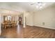 Open-concept living room with wood floors, arched entryways and natural light at 286 Prominent Loop, Mcdonough, GA 30253