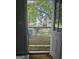 A wooden deck surrounded by trees, with a view of the neighborhood at 443 Walker St, Villa Rica, GA 30180