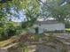A view of a backyard that shows the house, some greenery, and a chain link fence at 443 Walker St, Villa Rica, GA 30180
