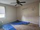 Bedroom showing window and ceiling fan with unfinished flooring at 443 Walker St, Villa Rica, GA 30180