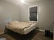 Bedroom with wood laminate flooring, window and light grey painted walls at 443 Walker St, Villa Rica, GA 30180