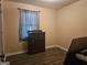 This bedroom offers neutral walls, wood laminate flooring and good natural light at 443 Walker St, Villa Rica, GA 30180