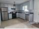 Functional kitchen with classic appliances and ample cabinet space for storage at 443 Walker St, Villa Rica, GA 30180