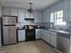 Functional kitchen with classic appliances and ample cabinet space for storage at 443 Walker St, Villa Rica, GA 30180