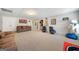 Expansive basement living area with comfortable seating, entertainment setup, and a clean, open design at 5585 Lavender Farms, Powder Springs, GA 30127
