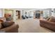 Basement area with a wet bar and comfortable seating, designed for entertainment and relaxation at 5585 Lavender Farms, Powder Springs, GA 30127