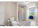 Bathroom features a white vanity, tile floors, and a shower with glass door at 5585 Lavender Farms, Powder Springs, GA 30127