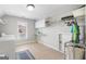 Bright laundry room with cabinets, tile flooring, and a closet space at 5585 Lavender Farms, Powder Springs, GA 30127