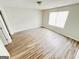 Bedroom with wood-look flooring, and a window for natural light at 8201 Fairington Village Dr, Lithonia, GA 30034