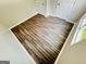 Bedroom has two doors for ensuite bathroom/closet and wood-look floors at 8201 Fairington Village Dr, Lithonia, GA 30034