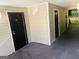 Apartment complex featuring dark-colored doors and light beige exterior siding at 8201 Fairington Village Dr, Lithonia, GA 30034