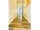 Hallway features wood-look flooring leading to a room with natural light at 8201 Fairington Village Dr, Lithonia, GA 30034