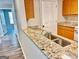 Kitchen sink and breakfast bar, leading into living room at 8201 Fairington Village Dr, Lithonia, GA 30034