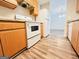 Efficient kitchen with wooden cabinets and modern appliances, adjacent to the living area at 8201 Fairington Village Dr, Lithonia, GA 30034