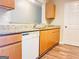 Kitchen featuring stylish countertops, wooden cabinets, and modern appliances at 8201 Fairington Village Dr, Lithonia, GA 30034