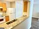 Kitchen with a breakfast bar and modern appliances open to living space at 8201 Fairington Village Dr, Lithonia, GA 30034