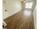 A bright living room with sleek flooring and a modern ceiling fan at 8201 Fairington Village Dr, Lithonia, GA 30034
