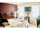 Comfortable bedroom features a large bed, dresser, TV and windows with natural light at 150 Ashley Dr, Fayetteville, GA 30214