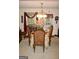 Elegant dining room featuring a chandelier, decorative table setting, and French doors to the exterior at 150 Ashley Dr, Fayetteville, GA 30214