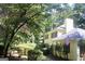 Exterior angle showcasing the yard and side of the house with a partial view of the front at 150 Ashley Dr, Fayetteville, GA 30214