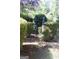 Charming garden with bird bath, colorful wind spinner, birdhouse, and lush greenery, creating a serene outdoor space at 150 Ashley Dr, Fayetteville, GA 30214