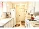 Well-lit kitchen featuring white cabinets, modern appliances and ample counter space at 150 Ashley Dr, Fayetteville, GA 30214
