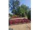 Beautiful landscaping with colorful flowers, manicured bushes and trees creating a welcoming and vibrant outdoor environment at 150 Ashley Dr, Fayetteville, GA 30214