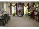 Comfortable living room boasts large windows, a decorative bookshelf, and a cozy couch for relaxation at 150 Ashley Dr, Fayetteville, GA 30214