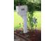 Charming mailbox adorned with flowers and greenery, enhancing curb appeal at 150 Ashley Dr, Fayetteville, GA 30214
