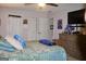 Well-decorated bedroom with a large bed, wooden dresser, and ample closet space at 150 Ashley Dr, Fayetteville, GA 30214