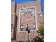 Exterior of brick building with a mural saying 'Great Adventure Awaits' in Trilith at 150 Ashley Dr, Fayetteville, GA 30214