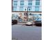 The Land of Imagination mural on the side of a building with three reading books at 150 Ashley Dr, Fayetteville, GA 30214