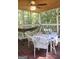 Charming screened porch with a hammock and comfortable seating creating a perfect space to unwind and enjoy the outdoors at 150 Ashley Dr, Fayetteville, GA 30214
