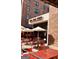 Outdoor patio seating with tables, chairs, and umbrellas at Pizza Wings Friends restaurant at 150 Ashley Dr, Fayetteville, GA 30214