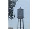 Water tower with the logo for Trilith Studios against a partly cloudy blue sky at 150 Ashley Dr, Fayetteville, GA 30214