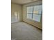 Bright bedroom with a large window and neutral carpet offers a serene and inviting space at 3219 Fairington Dr, Lithonia, GA 30038