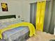 Comfortable bedroom featuring neutral colors and a bright yellow throw at 3219 Fairington Dr, Lithonia, GA 30038