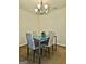 Cozy dining area adjacent to the kitchen, featuring stylish decor and ample seating for four at 3219 Fairington Dr, Lithonia, GA 30038