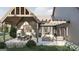 Inviting back patio with a covered dining area and lounge seating, perfect for outdoor entertaining at Lot 1 Bohannon Drive # 1, Fairburn, GA 30213