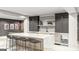 Finished basement bar featuring a marble countertop, modern stools, and custom cabinets at Lot 1 Bohannon Drive # 1, Fairburn, GA 30213