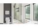 Sleek bathroom featuring a glass enclosed shower, toilet, and large windows allowing natural light to brighten the space at Lot 1 Bohannon Drive # 1, Fairburn, GA 30213