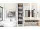 Spa-like bathroom with a soaking tub, illuminated shelving, and and sinks with marble countertops at Lot 1 Bohannon Drive # 1, Fairburn, GA 30213