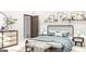 Cozy bedroom featuring blue bedding, wood-look floors, and a decorative shelf with framed wall art at Lot 1 Bohannon Drive # 1, Fairburn, GA 30213