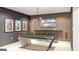 Entertainment room featuring a pool table, bar-style seating, wood paneling, and framed sports memorabilia at Lot 1 Bohannon Drive # 1, Fairburn, GA 30213