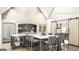 A stunning kitchen featuring stone walls, a marble backsplash, and a large center island with seating at Lot 1 Bohannon Drive # 1, Fairburn, GA 30213