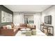 Comfortable living room with a large sectional couch, a window with light-blocking shades, and modern wall art at Lot 1 Bohannon Drive # 1, Fairburn, GA 30213