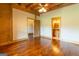 Wood-paneled bedroom with doors and windows with a view into attached bathroom and bonus room at 1051 Lake Rutledge Rd, Rutledge, GA 30663