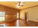 Bright bedroom with hardwood floors, a ceiling fan, and large windows letting in lots of natural light at 1051 Lake Rutledge Rd, Rutledge, GA 30663