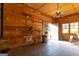Bright bonus room with natural light, wood paneled walls, and access to the outdoors at 1051 Lake Rutledge Rd, Rutledge, GA 30663